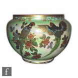 A 1930s Crown Devon Lustrine jardiniere decorated with parrots perched on flowering branches, all to