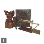 A 19th Century mahogany and brass balance scale with a single barrel weight, also a carved