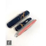 Two tortoiseshell pen knives and a hallmarked pink enameled pocket knife. (3)