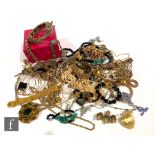 A parcel lot of assorted costume jewellery to include Butler and Wilson and other chains,