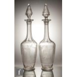 A pair of late 19th Century Richardsons clear crystal glass decanters of footed shouldered ovoid