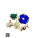 Five assorted 14ct pendants to include a lapis lazuli, a malachite, a two coloured elephant, an