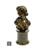 A 19th Century French bronze bust of a semi naked maiden in the Art Nouveau style wearing a gilt