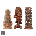 A collection of carved Asian figures, to include a Japanese rootwood figure of Ebisu, modelled