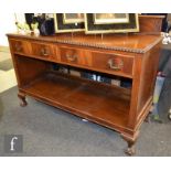 An Edwardian two tier mahogany buffet with gadrooned edge over two drawers on ball and claw feet,