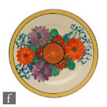 Clarice Cliff - Gay Day - A circular plate circa 1930 hand painted with radial flowers and foliage