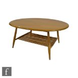 Lucian Ercolani for Ercol Furniture - A model 454 supper or coffee table of oval form, the oak top