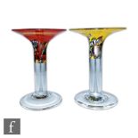 Bertil Vallien - Kosta Boda - A pair of Satellite candlesticks, each with clear circular foot and