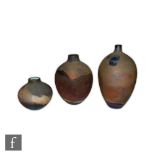 Simon Rich - Three contemporary studio pottery raku fired vases of varying form, all with
