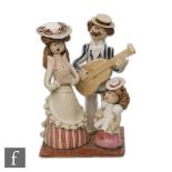 Laura Dunn - A later 20th Century studio pottery family figure of a lady, gentleman and a young girl