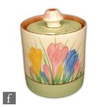 Clarice Cliff - Spring Crocus - A small Drum shaped preserve pot and cover circa 1936, hand