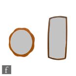 Unknown - Two 1960s teak wall mirrors to include one with a rounded rectangular frame, 79cm x