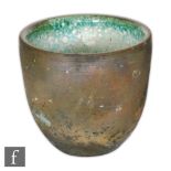 Mansour Eskandary - A contemporary Raku pottery beaker vase, the exterior with a burnished effect