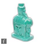 Heinrich Hoffmann - A 1930s green malachite glass figure of a stylised elephant carrying a howdah