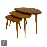 Lucian Ercolani for Ercol Furniture - A nest of three post war model 354 blonde elm and beech Pebble