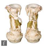 Royal Dux - A mirrored pair of early 20th Century Art Nouveau vases each of slender globe and