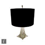 St Louis - A glass table lamp on a spreading square form base rising to a tapered clear