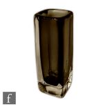 Nils Lansberg - Orrefors - A glass vase of rectangular form with a smoke grey core cased in clear,