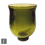 Floris Maydam - Leerdam - A Unica green glass vase of ovoid form with flared rim, raised to a