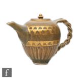 Bridget Drakeford - A contemporary studio pottery teapot of ovoid form with a plated handle, the