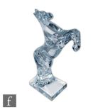 Daum - A large clear crystal glass figure of a stylised prancing horse with legs raised, falling