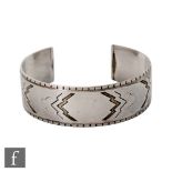 Oscar Gundlach-Pedersen - Georg Jensen - A Danish sterling silver torque bangle with an Art Deco