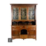 Unknown - In the manner of Shapland and Petter - A mahogany bookcase cabinet with repousse copper