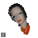 Goldscheider - A 1930s Art Deco wall mask modelled as a lady in profile with black curled hair,