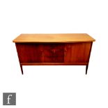 Peter Hayward for W.G. Evans (Vanson) - A sideboard fitted with a central bank of three drawers