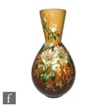Devon Ware - An early 20th Century Arts and Crafts vase of globe and shaft form decorated with