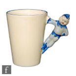 Clarice Cliff - Gnome Ware - A beaker, post 1936, with figural handle modelled as a pixie washed