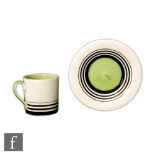 Susie Cooper - A small Tango coffee can and saucer, hand painted with graduated black bands and a