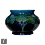 William Moorcroft - Moonlit Blue - A vase of compressed ovoid form with everted rim circa 1925,
