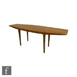 Unknown - A post war walnut coffee table of surfboard shaped outline, with inset African blackwood