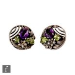 Bernard Instone - A pair of 1930s Art Deco clip earring of circular form set with purple and green
