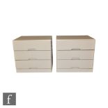 Hulsta, Germany - A pair of white lacquered lamp tables or bedside chests of three drawers,