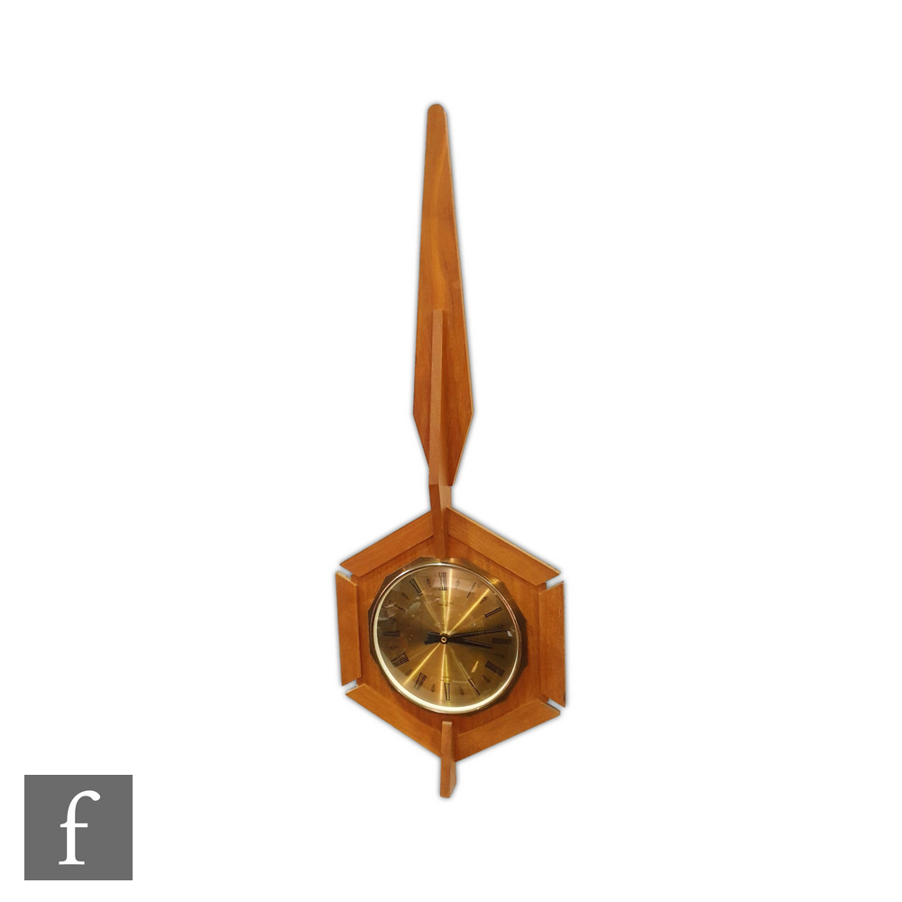 Anstey & Wilson - A 1960s wall clock with a central dial within a hexagonal teak frame with spire