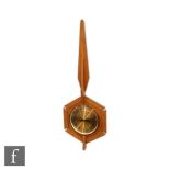 Anstey & Wilson - A 1960s wall clock with a central dial within a hexagonal teak frame with spire
