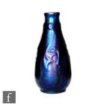 Unknown - An early 20th Century European Art Nouveau bottle vase with stylised leaf moulded relief