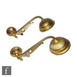 In the manner of Christopher Dresser - A pair of late 19th Century brass wall lights in the