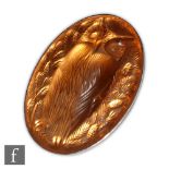 Lalique - A modern glass brooch in the Hibou pattern of oval section, relief moulded with an owl