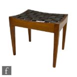 Arthur Simpson of Kendal - An Arts and Crafts oak framed stool of dished rectangular form with woven