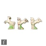 Clarice Cliff - Spring Lambs - A set of three leaping lamb figures with flowers and grasses picked