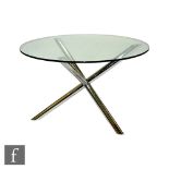 In the manner of Pieff Furniture - A glass top dining table of circular form raised to chromium