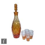 Moser - A 1920s dichoric glass decanter of slender bottle form with tall stopper, the whole cut in