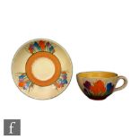 Clarice Cliff - Crocus - A Globe shape teacup and saucer circa 1930, hand painted with crocus sprays