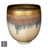 Hazel Johnston - A contemporary studio pottery vase of footed flared form, decorated with a dribbled