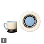 Susie Cooper - A small Tango coffee can and saucer, hand painted with graduated black bands and a