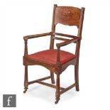 Unknown, possibly Bath Cabinet Makers - An Arts and Crafts oak open armchair, the rail and panel