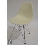 Charles and Ray Eames - Vitra - A late 20th Century white DSR Eames Plastic Chair on Eiffel Tower